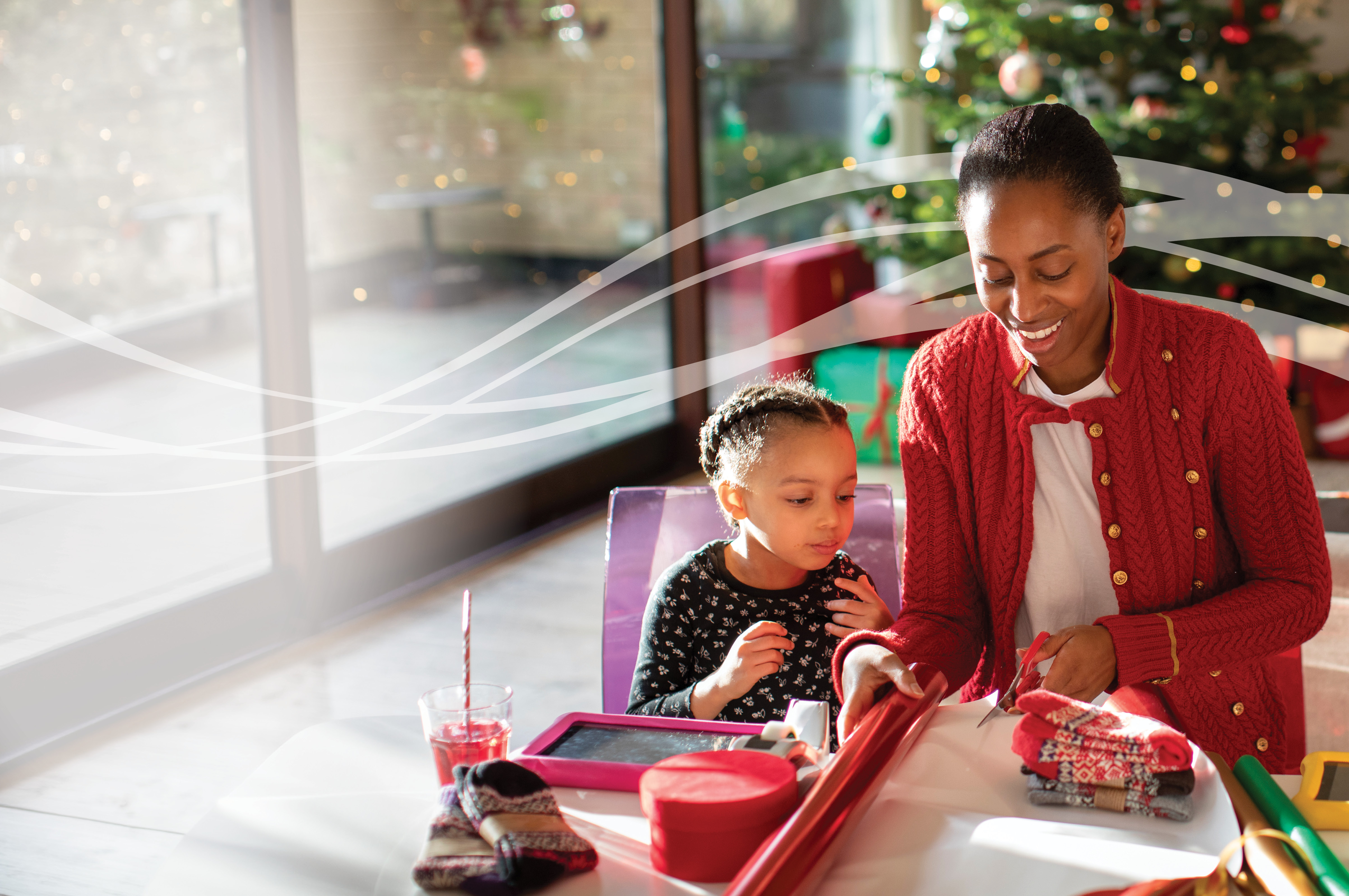Family wrapping holiday presents together